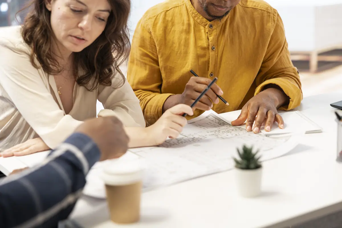 Realtors meeting with business owner to go over all contract terms